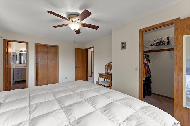 7150 Upper 157th St W, Apple Valley, MN 55124 - bedroom featuring a spacious closet, a closet, carpet flooring, connected bathroom, and ceiling fan
