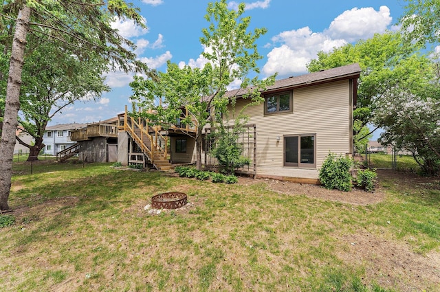 7150 Upper 157th St W, Apple Valley, MN 55124 - rear view of property with stairway, an outdoor fire pit, a deck, and a gate