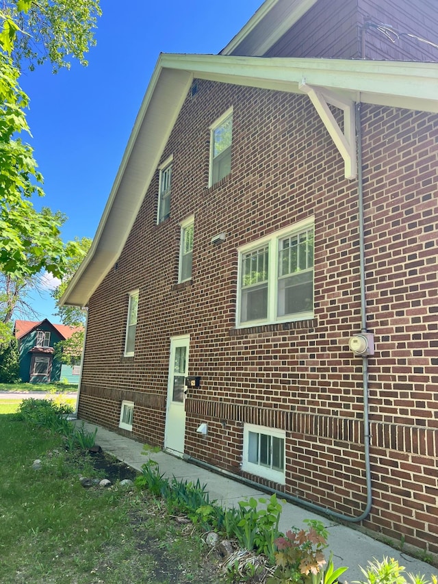 623 4th St, Madison, MN 56256 - view of side of property featuring brick siding
