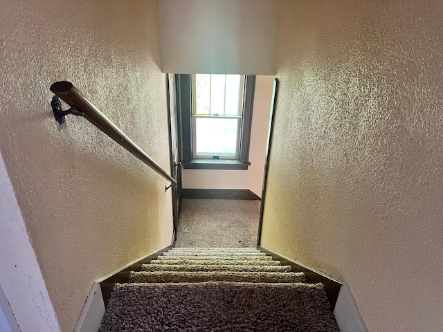 623 4th St, Madison, MN 56256 - stairway with a textured wall and carpet flooring