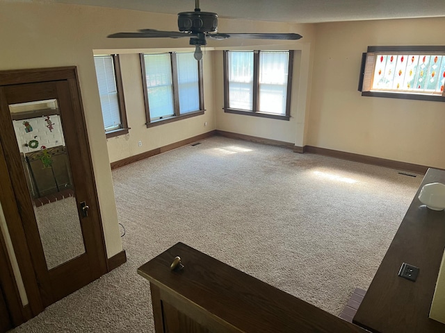 623 4th St, Madison, MN 56256 - carpeted spare room featuring ceiling fan and baseboards