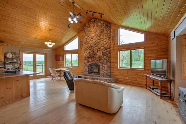 2200 405th Ave NW, Braham, MN 55006 - living area with wood ceiling, high vaulted ceiling, a fireplace, rail lighting, and light wood finished floors