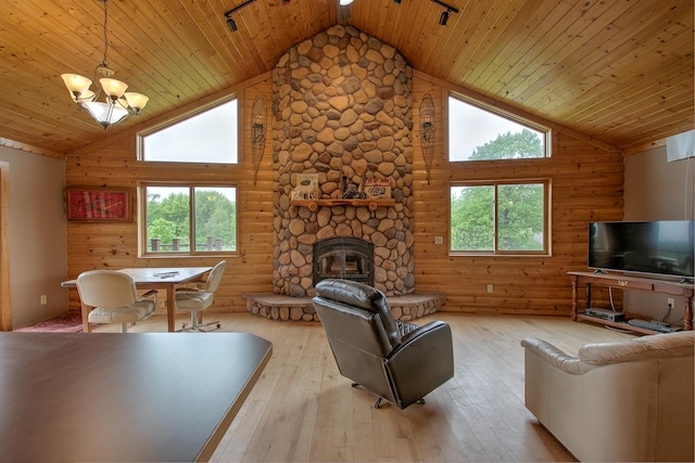 2200 405th Ave NW, Braham, MN 55006 - living area with high vaulted ceiling, light wood-style floors, a fireplace, wood ceiling, and a chandelier