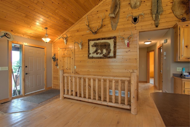 2200 405th Ave NW, Braham, MN 55006 - entrance foyer with lofted ceiling, light wood-style flooring, wood ceiling, and wooden walls