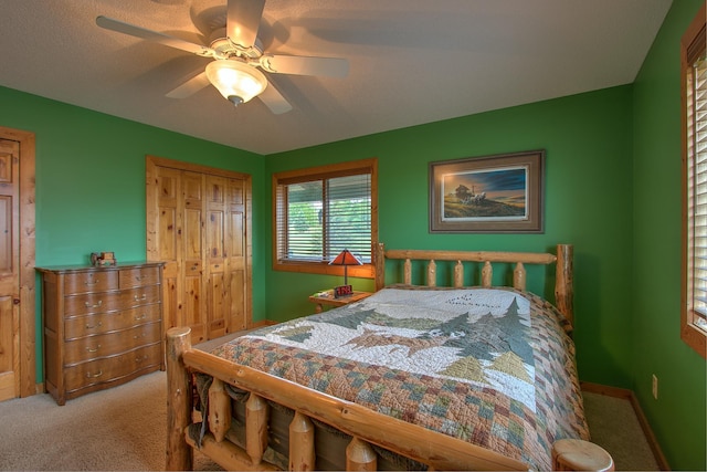 2200 405th Ave NW, Braham, MN 55006 - bedroom featuring carpet floors, ceiling fan, and a closet