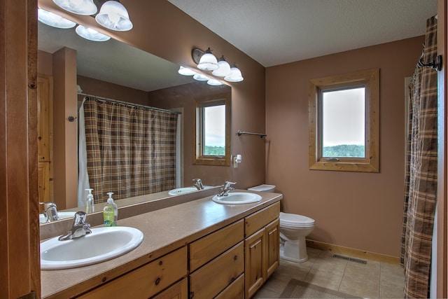 2200 405th Ave NW, Braham, MN 55006 - full bathroom with double vanity, plenty of natural light, tile patterned floors, and curtained shower