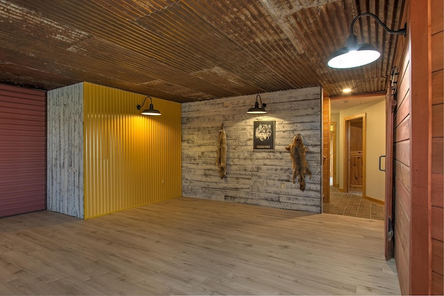 2200 405th Ave NW, Braham, MN 55006 - empty room with wood finished floors and wooden walls