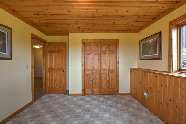 2200 405th Ave NW, Braham, MN 55006 - unfurnished bedroom with wood ceiling, light colored carpet, and a closet
