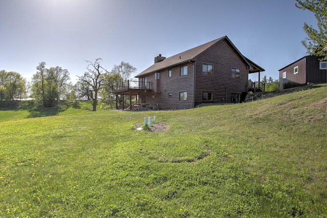 2200 405th Ave NW, Braham, MN 55006 - view of property exterior featuring a chimney, a wooden deck, and a yard
