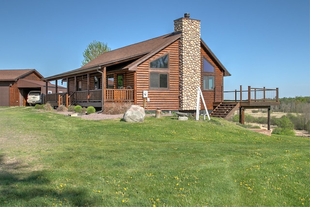 2200 405th Ave NW, Braham, MN 55006 - rear view of house with a chimney, a lawn, stairs, log exterior, and a wooden deck