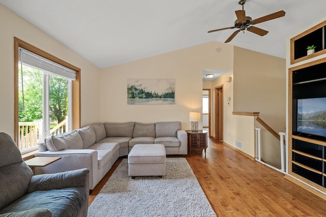 2572 91st Ln NE, Blaine, MN 55449 - living area with wood finished floors, lofted ceiling, a ceiling fan, and baseboards