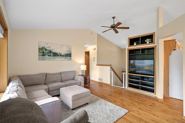 2572 91st Ln NE, Blaine, MN 55449 - living room with ceiling fan, wood finished floors, and vaulted ceiling