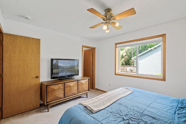 2572 91st Ln NE, Blaine, MN 55449 - bedroom featuring light carpet, ceiling fan, and baseboards