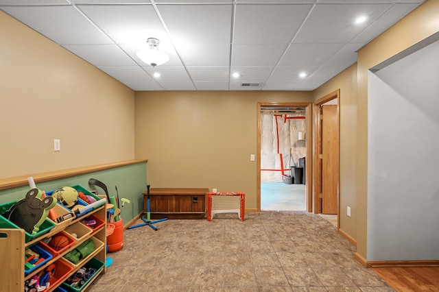 2572 91st Ln NE, Blaine, MN 55449 - rec room with recessed lighting, a paneled ceiling, and baseboards