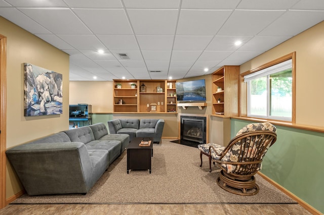 2572 91st Ln NE, Blaine, MN 55449 - living room featuring recessed lighting, baseboards, built in features, and a paneled ceiling