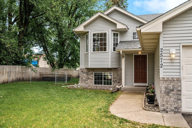 2572 91st Ln NE, Blaine, MN 55449 - view of front of home with brick siding and roof with shingles