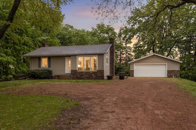 10180 County Road 43, Laketown Twp, MN 55318 - view of front of property featuring a chimney, stone siding, an outdoor structure, and a garage