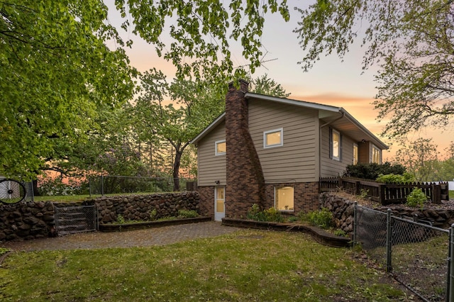 10180 County Road 43, Laketown Twp, MN 55318 - view of property exterior with a chimney and brick siding