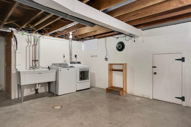 10180 County Road 43, Laketown Twp, MN 55318 - unfinished below grade area featuring independent washer and dryer, a sink, and concrete block wall