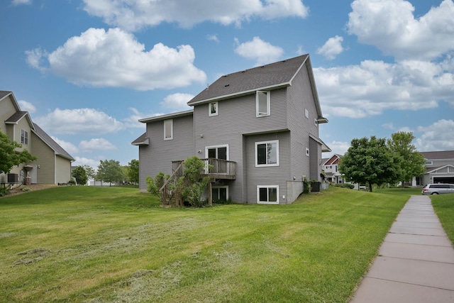 12396 67th St NE, Otsego, MN 55330 - back of house featuring a deck, a lawn, stairs, and a residential view