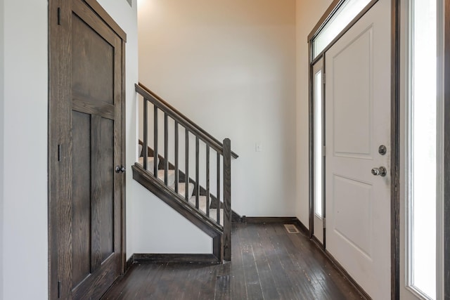 12396 67th St NE, Otsego, MN 55330 - foyer with dark wood-type flooring, baseboards, stairs, and healthy amount of natural light