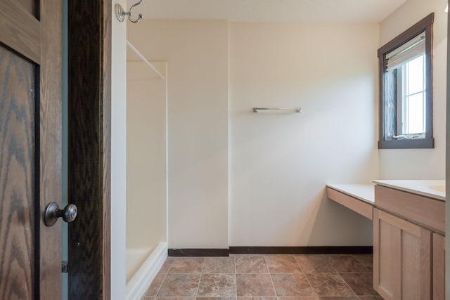 12396 67th St NE, Otsego, MN 55330 - full bath featuring baseboards, a shower, and vanity