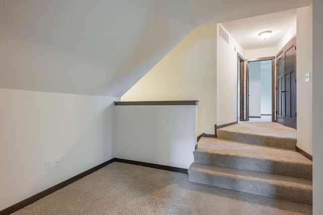 12396 67th St NE, Otsego, MN 55330 - stairway featuring carpet flooring, lofted ceiling, and baseboards