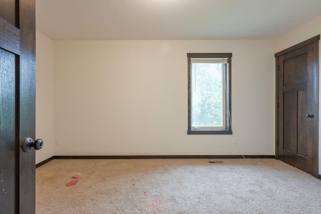 12396 67th St NE, Otsego, MN 55330 - spare room with carpet and baseboards