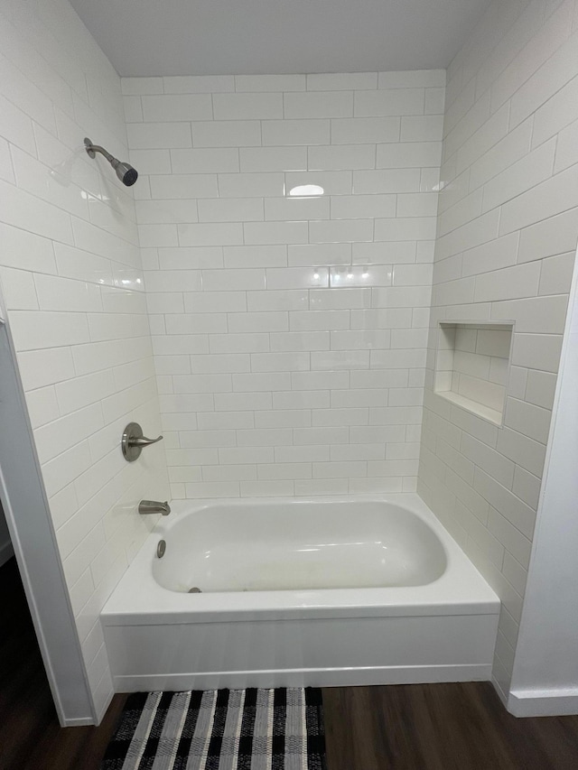 202 Main St W, Morristown, MN 55052 - bathroom featuring wood finished floors, shower / washtub combination, and baseboards