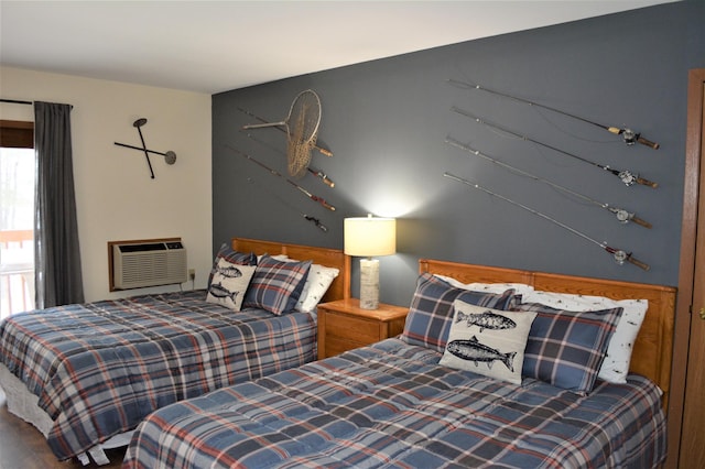15326 Birch Point Rd, Lenroot Twp, WI 54843 - bedroom featuring multiple windows, wood finished floors, and a wall mounted AC