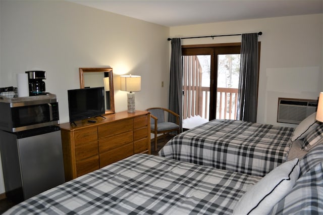 15326 Birch Point Rd, Lenroot Twp, WI 54843 - bedroom featuring a wall unit AC and access to exterior