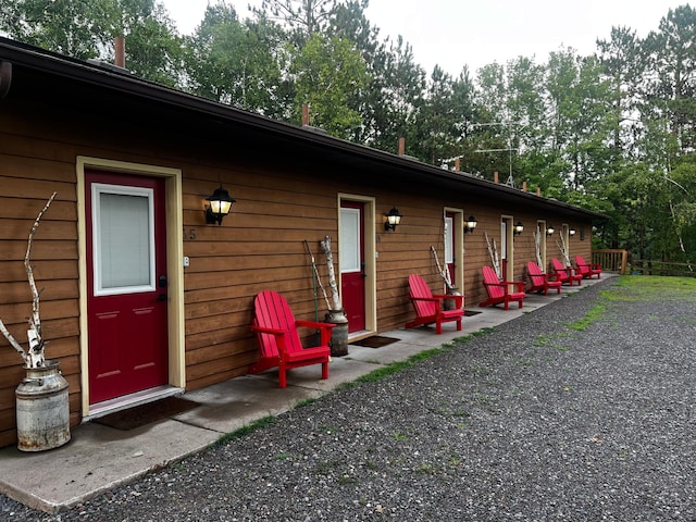 15326 Birch Point Rd, Lenroot Twp, WI 54843 - back of property with view of wooded area
