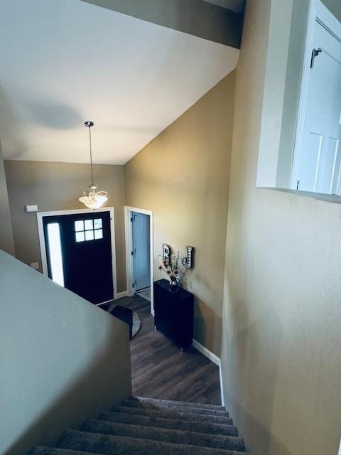 1320 Whiting Rd NW Unit 41, Bemidji, MN 56601 - stairs featuring wood finished floors, vaulted ceiling, baseboards, and a chandelier