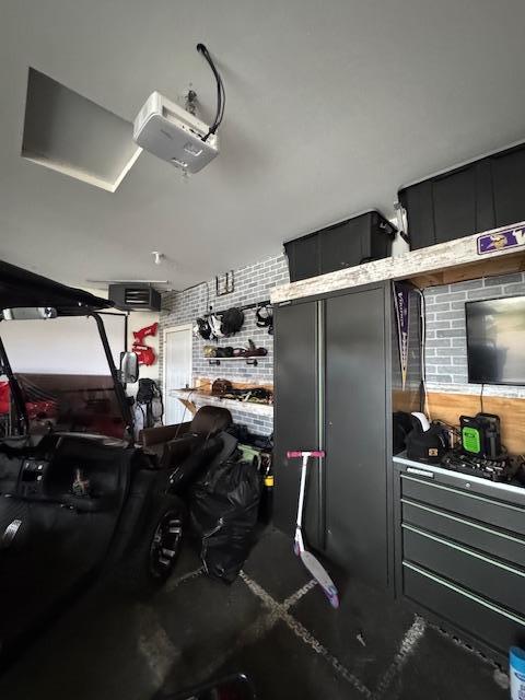 1320 Whiting Rd NW Unit 41, Bemidji, MN 56601 - garage featuring a garage door opener
