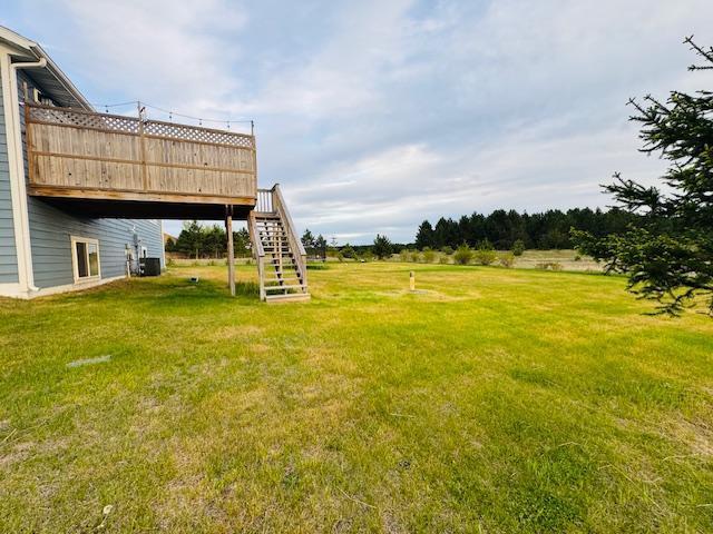 1320 Whiting Rd NW Unit 41, Bemidji, MN 56601 - view of green lawn with a wooden deck and stairway