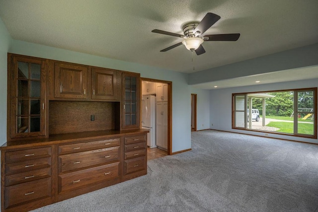 2851 120th Ave SW, Willmar, MN 56201 - unfurnished bedroom featuring freestanding refrigerator, light carpet, a textured ceiling, baseboards, and a ceiling fan