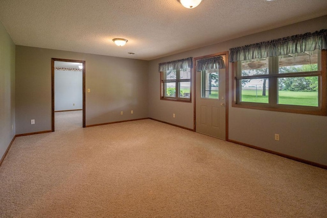 2851 120th Ave SW, Willmar, MN 56201 - empty room featuring a textured ceiling, light carpet, and baseboards
