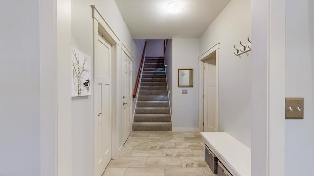 1829 Traders Point Ln SW, Rochester, MN 55902 - mudroom with baseboards and a textured ceiling
