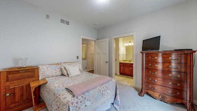 1829 Traders Point Ln SW, Rochester, MN 55902 - bedroom featuring a sink, ensuite bathroom, and light colored carpet