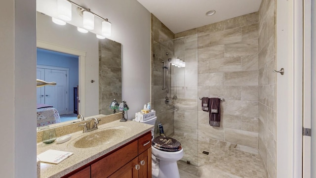 1829 Traders Point Ln SW, Rochester, MN 55902 - bathroom featuring vanity, toilet, a tile shower, and connected bathroom