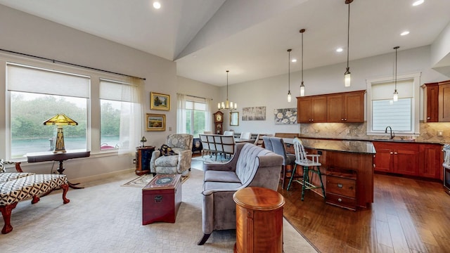 1829 Traders Point Ln SW, Rochester, MN 55902 - living area featuring dark wood-type flooring, a chandelier, recessed lighting, and high vaulted ceiling