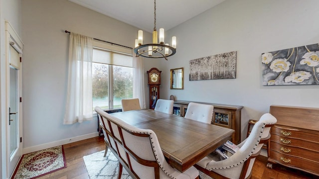 1829 Traders Point Ln SW, Rochester, MN 55902 - dining area with a chandelier, baseboards, and wood finished floors