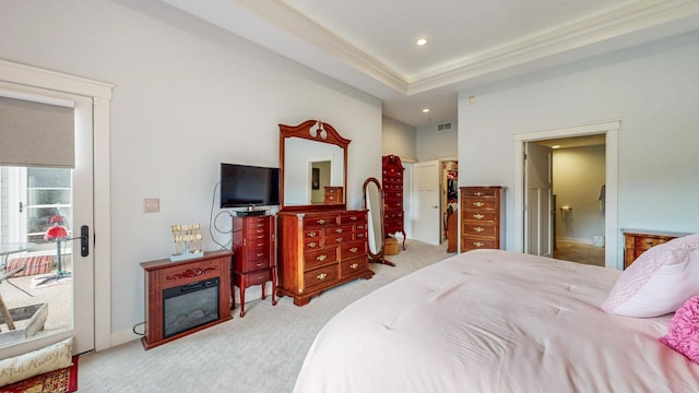 1829 Traders Point Ln SW, Rochester, MN 55902 - carpeted bedroom featuring a walk in closet, recessed lighting, ensuite bathroom, access to outside, and a glass covered fireplace