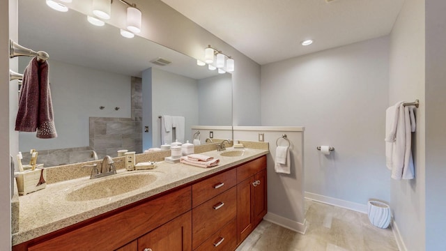 1829 Traders Point Ln SW, Rochester, MN 55902 - full bath with double vanity, baseboards, a walk in shower, and wood finished floors