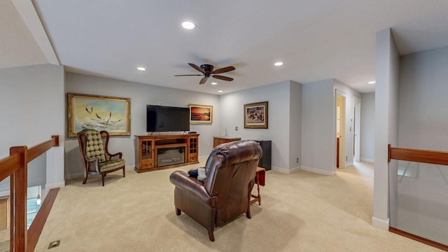 1829 Traders Point Ln SW, Rochester, MN 55902 - living room with recessed lighting, light carpet, ceiling fan, baseboards, and a glass covered fireplace