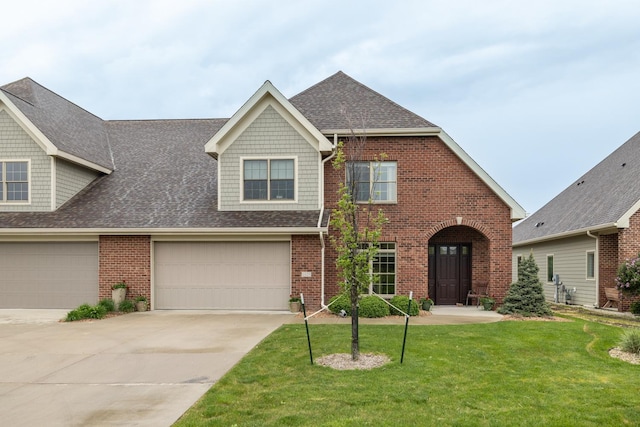 1829 Traders Point Ln SW, Rochester, MN 55902 - view of front of property with brick siding, a front lawn, a shingled roof, concrete driveway, and a garage