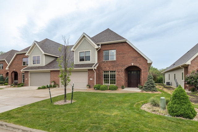 1829 Traders Point Ln SW, Rochester, MN 55902 - view of front facade with brick siding, an attached garage, concrete driveway, and a front yard