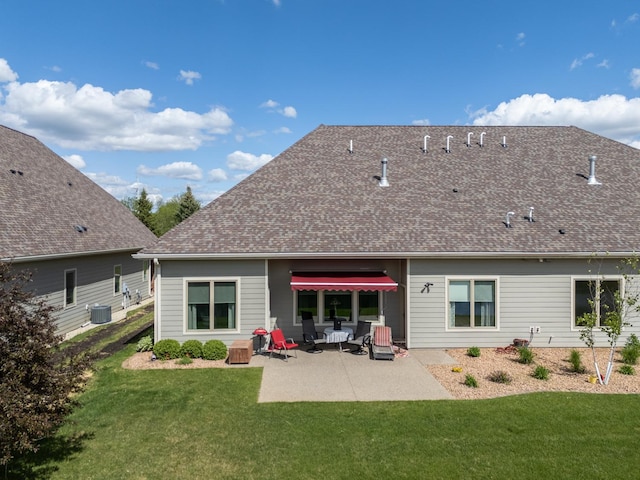 1829 Traders Point Ln SW, Rochester, MN 55902 - back of house featuring a patio, a lawn, and roof with shingles