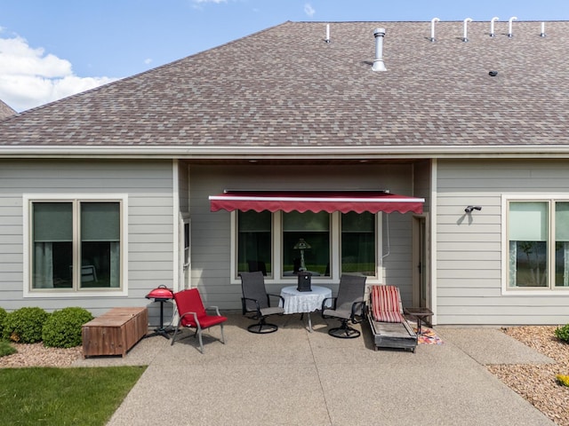 1829 Traders Point Ln SW, Rochester, MN 55902 - back of property featuring a patio and a shingled roof