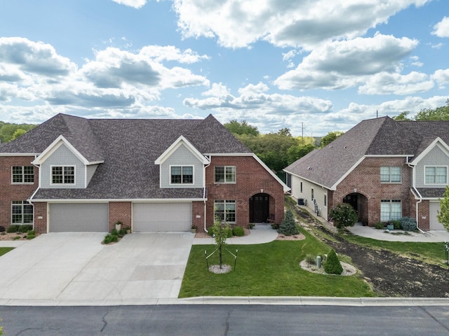 1829 Traders Point Ln SW, Rochester, MN 55902 - view of front of property featuring brick siding, driveway, a front lawn, and an attached garage